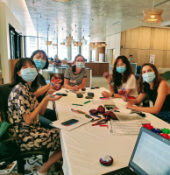 students sitting around a table on the first floor of Countway Library