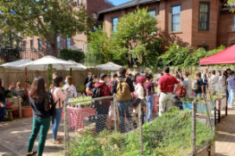 large group of people in the Countway Community Garden for an event
