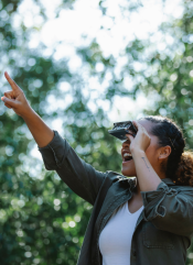A woman using binoculars